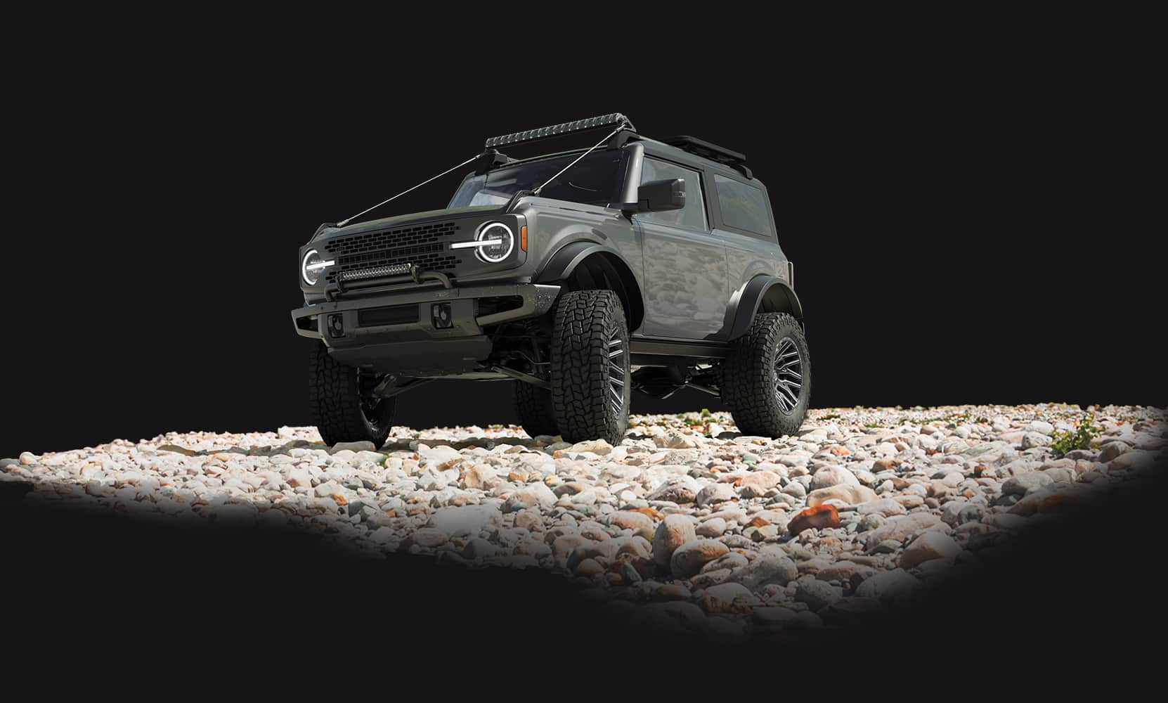 image of a Ford Bronco on a shoreline with Hercules Tire TerraTrac<sup>®</sup> AT X-Journey tires installed